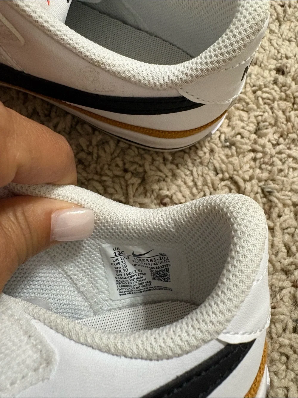 Nike White Sneakers with Black Swoosh and Gold Accent girls size 13 never worn